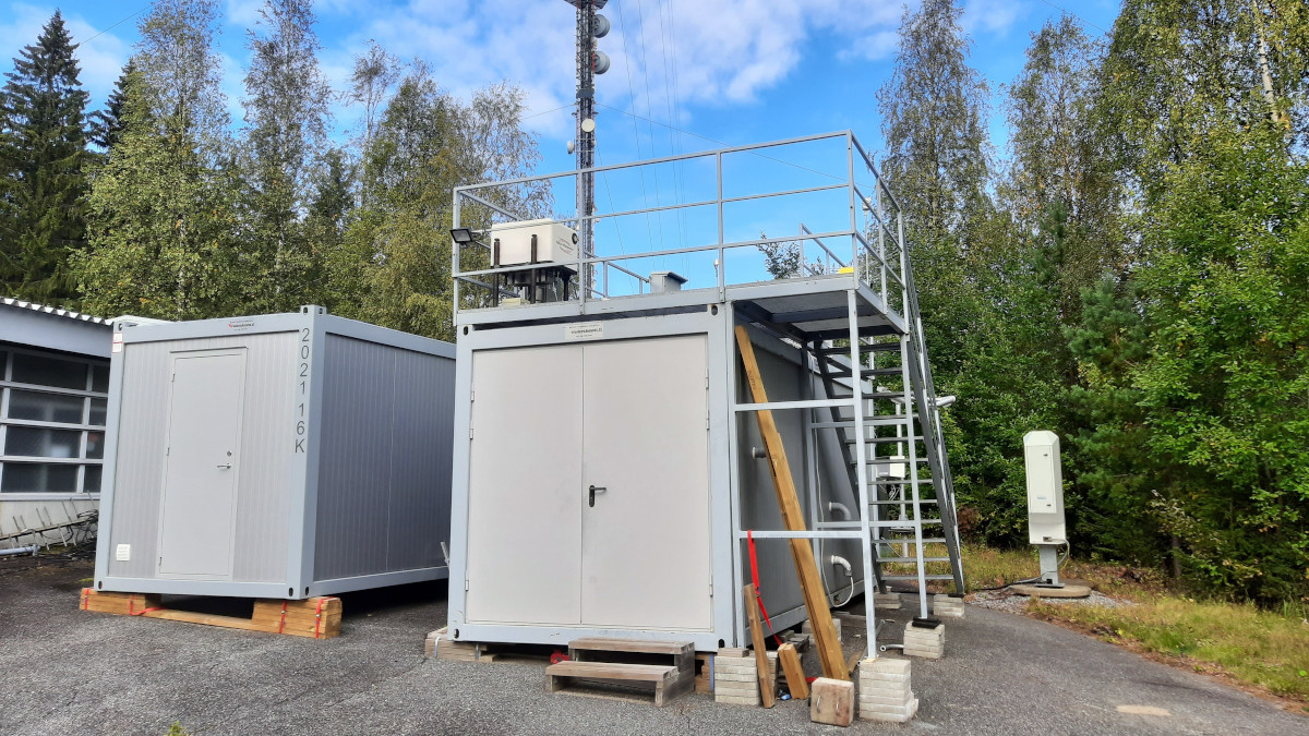 Measurement site at Vehmasmäki in Kuopio, nearby the radio and television transmitting mast. Finnish Meteorological Institute performs continuous measurements both in the mast and in, on, and next to a measurement container with several instruments.