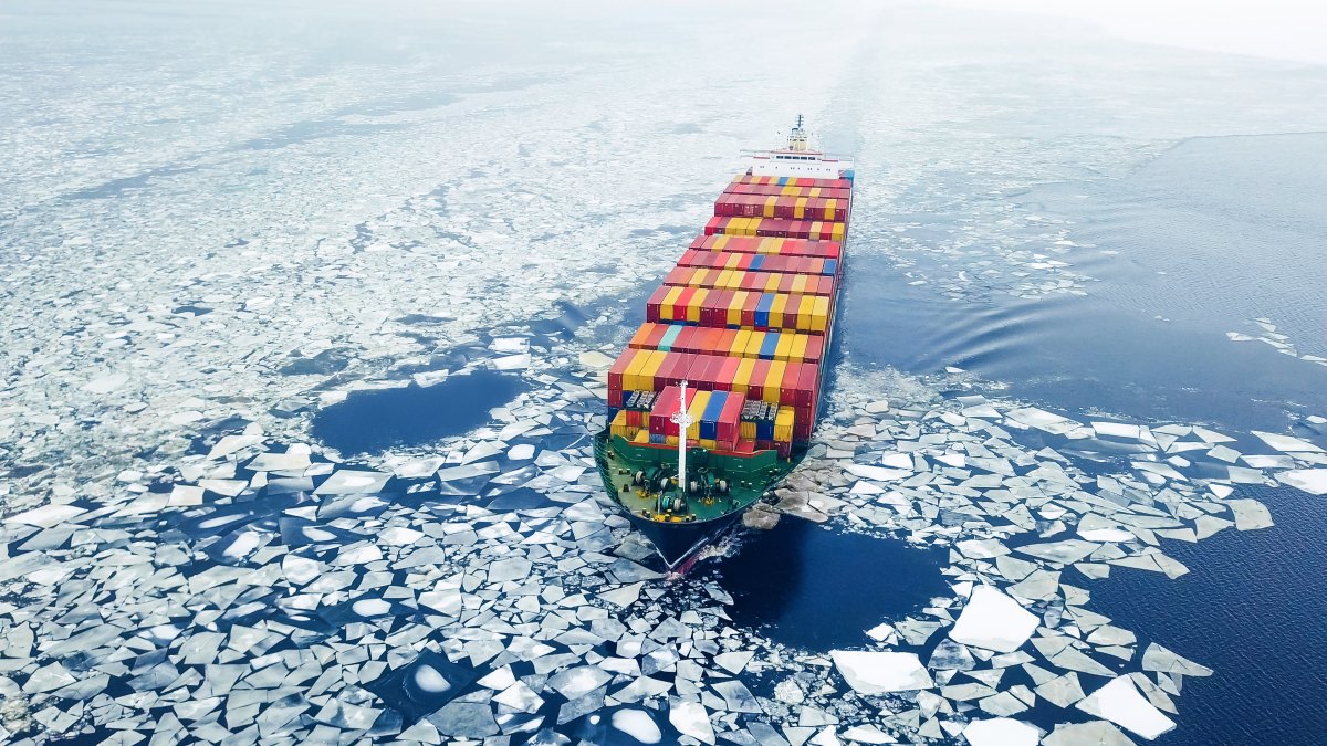 A cargo ship on an icy sea.
