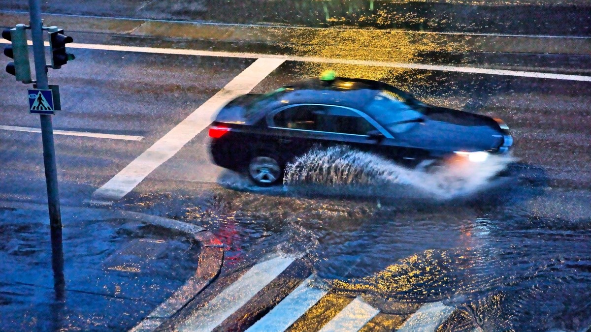 Car driving on rainy day.
