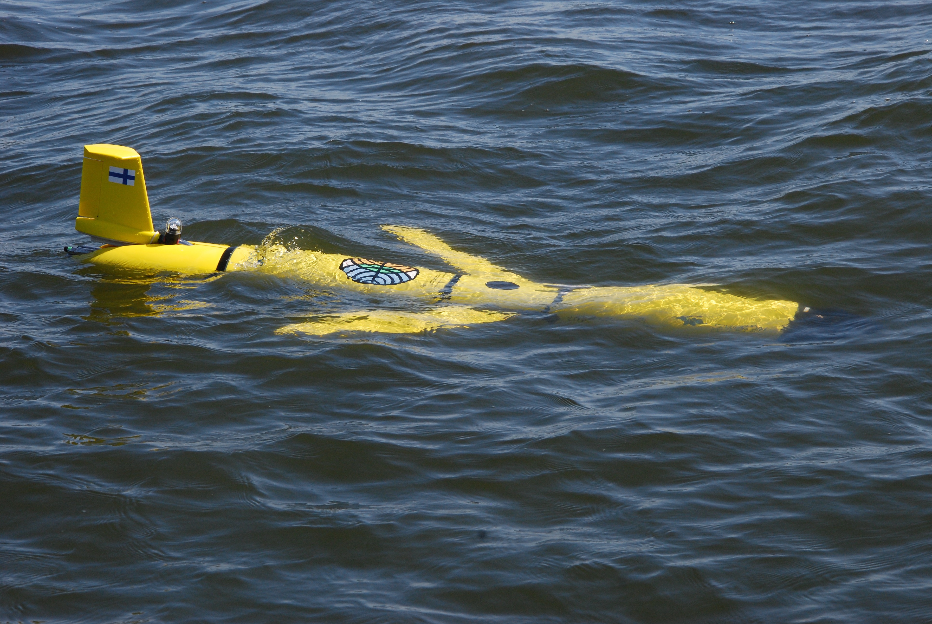 An airplane looking equipment swimming in the water.