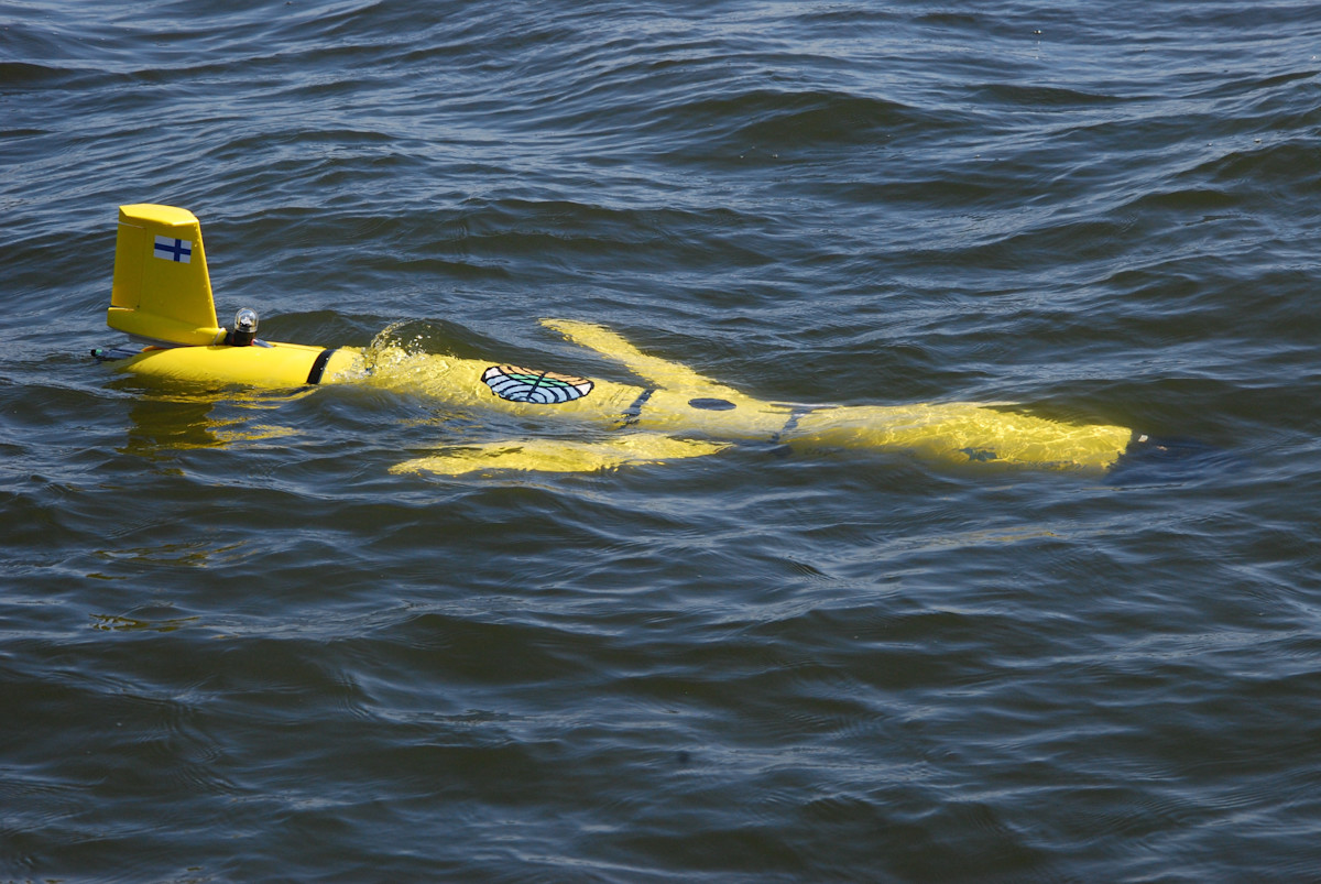 An airplane looking equipment swimming in the water.