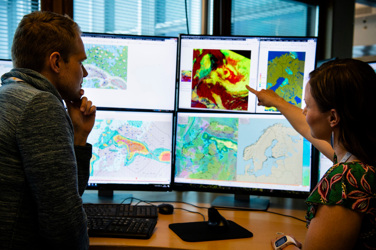 Meteorologists forecasting weather