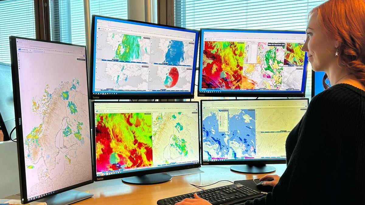 Meteorologist-on-duty with multiple weather screens in the FMI office.