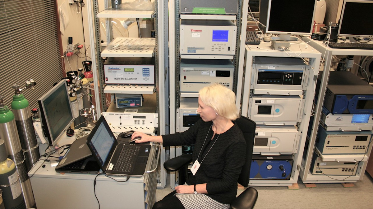 Laboratory worker and instrument rack