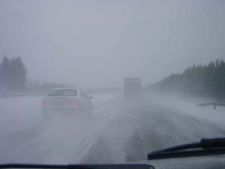 Snowy road and cars.